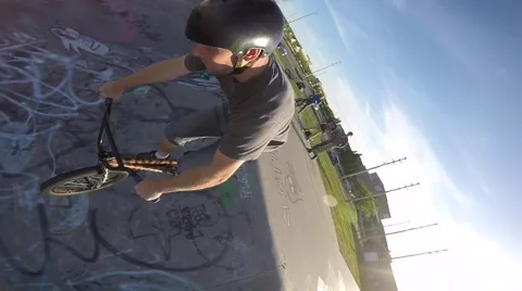 Bmx spinning head mount 360 jump Stock Footage 55357926