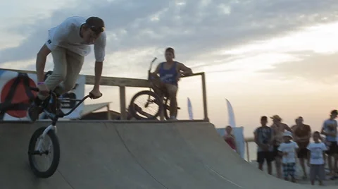 Bmx Stunts at Sunset. Slow Motion of professional Bmx Rider during his Stock Footage 60681130