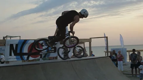 Bmx Stunts at Sunset. Slow Motion of professional Bmx Rider during his Stock Footage 60681302