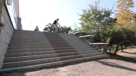BMX TRICK HUGE 360 over lots of stairs Video stock 55780059