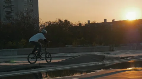 A bmx trick in sunset lighting Stock Footage 57346774