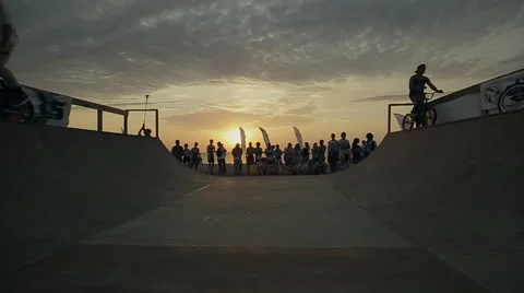 Bmx-vert in Slow Motion. athlete Makes Turns And jumps on a Bmx bike in the Stock Footage 60680790