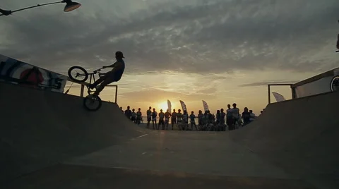 Bmx-vert in Slow Motion. athlete Makes Turns And jumps on a Bmx bike in the Stock Footage 60680799