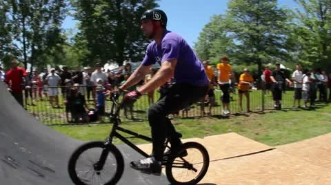 Bmx'er does a tailwhip to tailtap Stock Footage 8960181
