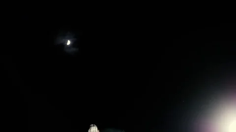 BMXer doing 360 no hander trick with moon in the background Stock Footage 73558872