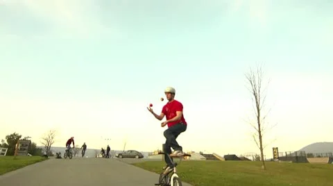 BMXer Juggling Down a Hill Stock Footage 20464367