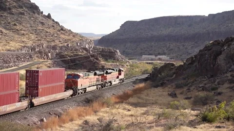 BNSF Freight Train going through mountains near Kingman Arizona Stock Footage 144902228