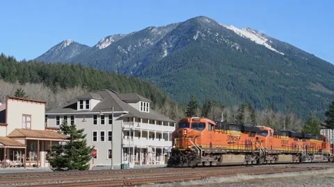 BNSF freight train passing Skykomish and Cascade Mountains Stock Footage 291597256