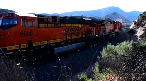 BNSF train moving though the Cajon pass in California USA Stock Footage 63965920
