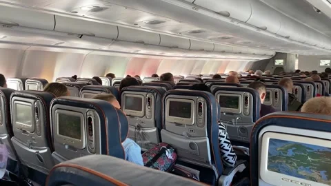 On board an Airbus A330, in flight, three rows of seats Stock Footage 137956789
