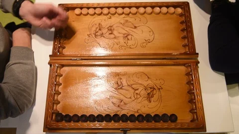 Board of backgammon and hands of two players Stock Footage 120111764
