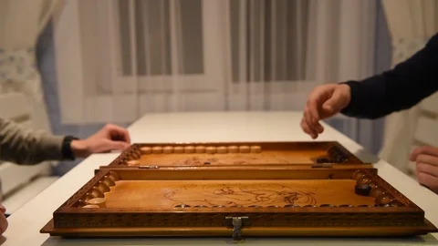 Board of backgammon and hands of two players Video stock 120111836