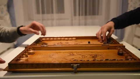 Board of backgammon and hands of two players Stock Footage 120111840