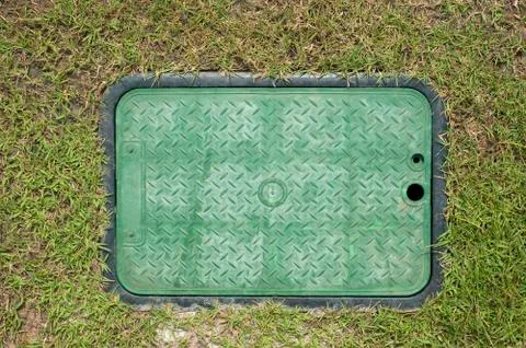 Board background on the green grass Stock Photos
