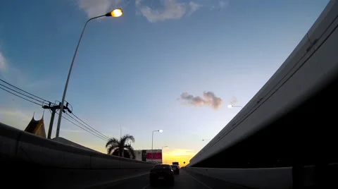 On-board camera on a car driving on road in the sunset Stock Footage 55722968