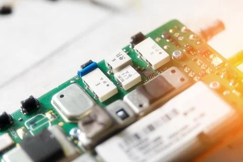 Board with chips, electronic chips, transistors and capacitors close-up. Elec Stock Photos