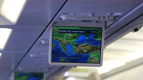 On-board computer display with a map of flight, speed, altitude and temperature Stock Footage 84652915