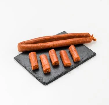 Board with delicious cured sausage Stock Photos