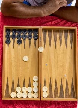 A board game a man thinks of a move on a board game (License=RF) 12569812 ... Stock Photos