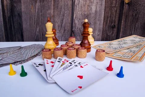 Board games on a light background playing cards, bingo, bingo cards, board ga Stock Photos