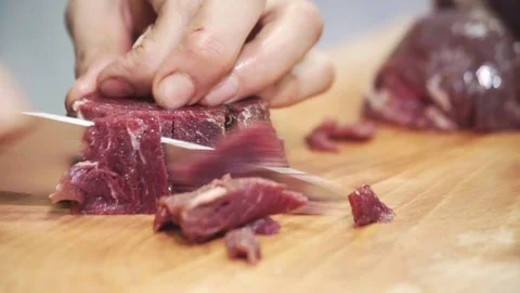 On board a human being cut into chunks with a knife red meat metal Stock Footage 71516582