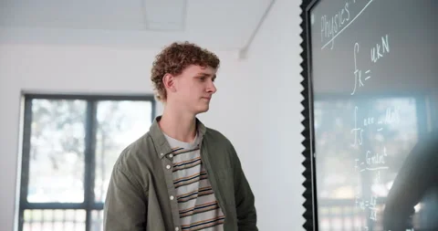 Board, man and problem solving for physics in university and studying hard math Stock Footage 280835983