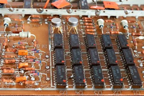 Board with microcircuits and other electrical elements. Close-up. Stock Photos