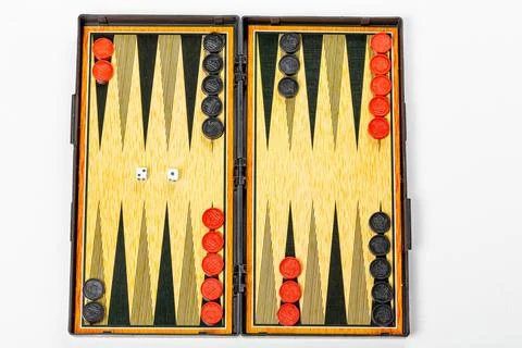 Board for playing backgammon with pieces and dice on a white background. To.. Stock Photos
