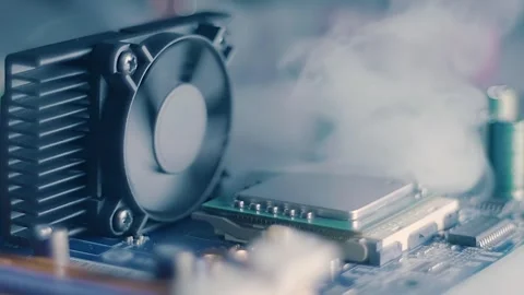 On board with processor smoke appears and is sucked in by the fan Stock Footage 313224748