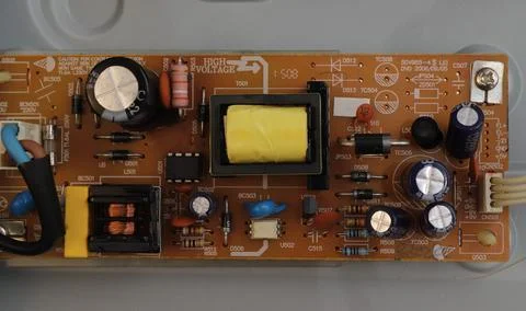 The board of a radio engineering device is shown with transistors, capacito.. Stock Photos