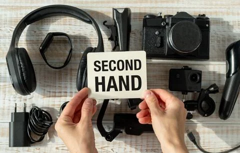 A board with "second hand" text, shown on an old unfolded technique. The co.. Stock Photos