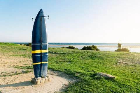 Board surf shower on the beach. Stock Photos