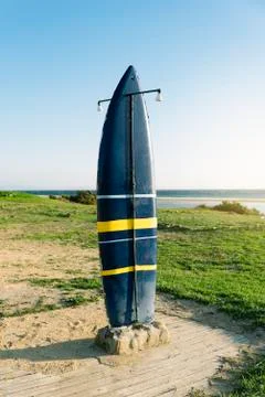Board surf shower on the beach. Stock Photos