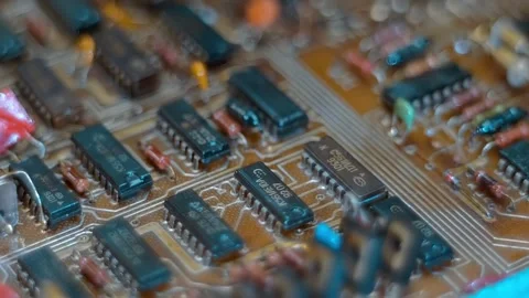 On the board there are many parts filled with varnish to prevent short circuits Stock Footage 259860153
