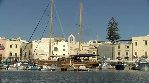 On board view of a boat leaving a small port Stock Footage 60390156