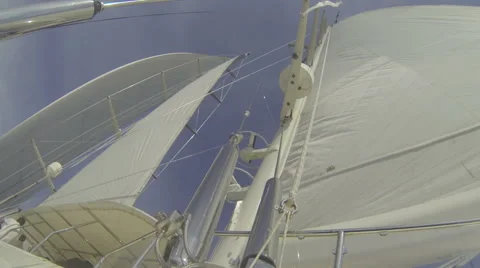 On board view of mast and sails of luxury sailing yacht navigating during regatt Stock Footage 52785389