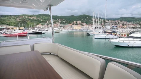 On board view of upper deck of a luxury yacht leaving the port Stock Footage 71827425