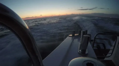 On board view of the wake of a boat navigating at the sunset Stock Footage 67569339