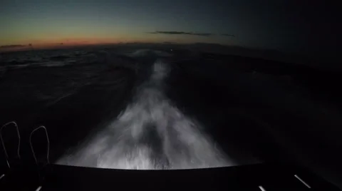 On board view of the wake of a boat navigating at night Stock Footage 67569376