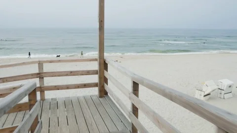 Board walk on beach in slow motion Video stock 71564838