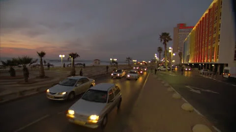 Board walk with traffic Tel Aviv Pan Righ to Left Night Stock Footage 25136122