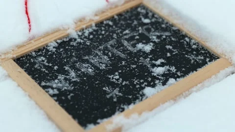 Board with winter text snow falling Stock Footage 146812001