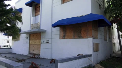 Boarded up apartment complex Stock Footage 244405924