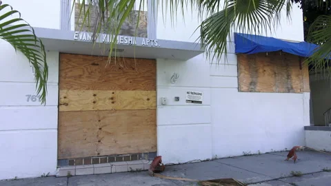 Boarded up apartment complex front Stock Footage 244405834