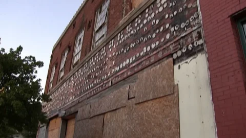 Boarded up building - pan down from top Stock Footage 96035663