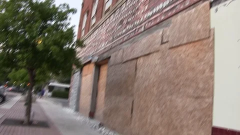 Boarded-up building - pan up Stock Footage 96035642