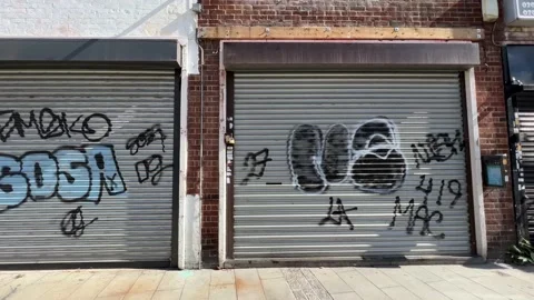 Boarded up shops in a deprived area Stock Footage 202635242