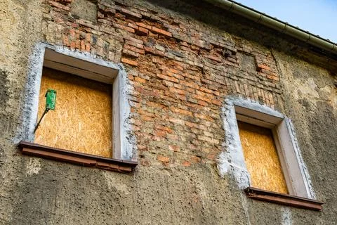 Boarded Up Windows On An Old Brick Building In Daylight Stock Photos