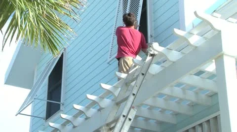 Boarding up approaching Hurricane Stock Footage 12568890