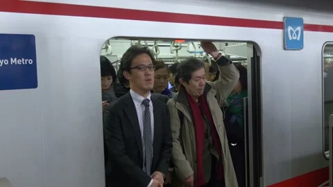 Boarding A Busy Train During Rush Hour Inside The Tokyo Metro In Tokyo, Japan Stock Footage 159056747